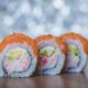 Delicious salmon sushi rolls with a vibrant and fresh look, perfect for food enthusiasts.